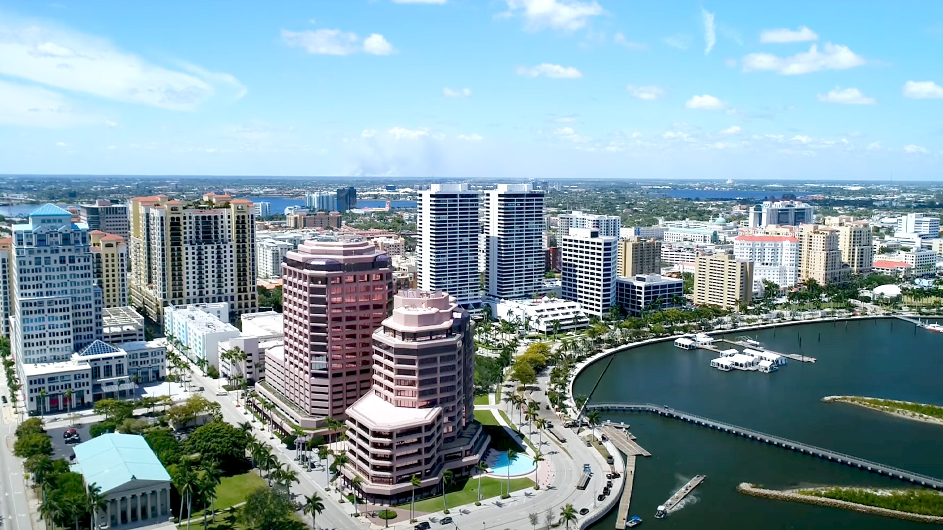 Aerial view of Palm Beach's skyline featuring modern commercial buildings and waterfront, highlighting urban development relevant to Leighton McGinn's construction projects.