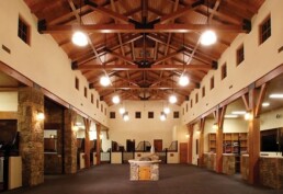 A large room with vaulted ceilings and stone walls.