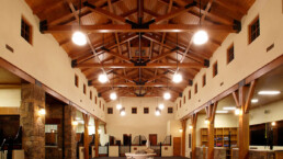 A large room with wooden ceilings and beams.
