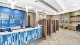 A reception area with blue and white tile.